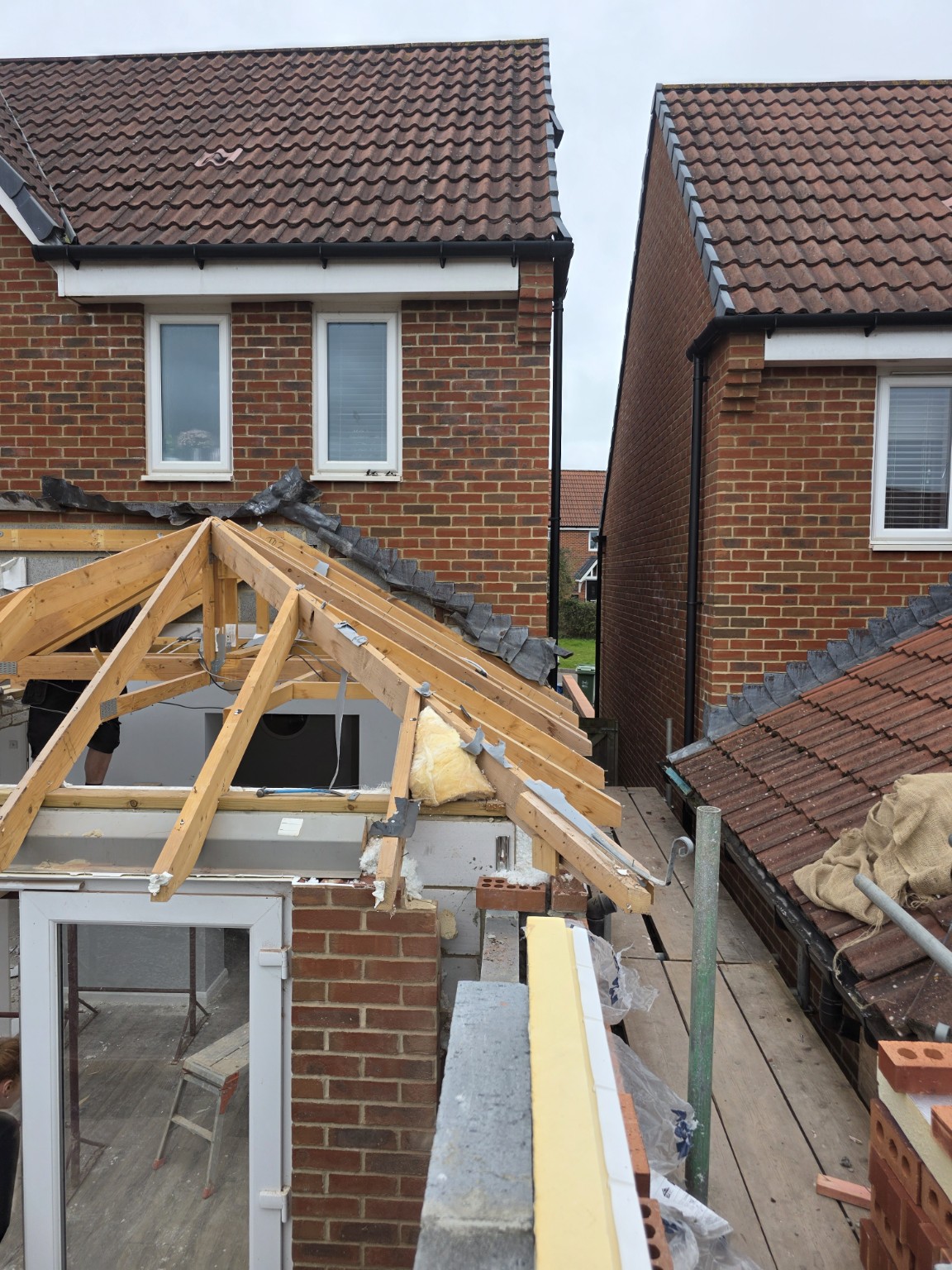 Extension under construction with timber roof framing