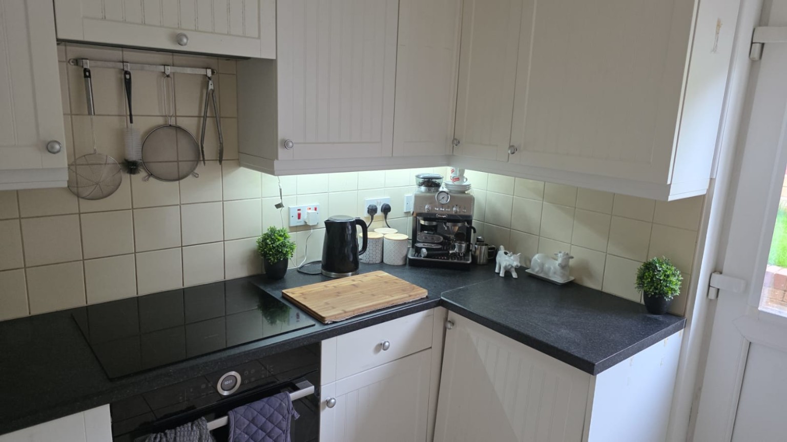 Tiverton kitchen with white cabinets during alteration work