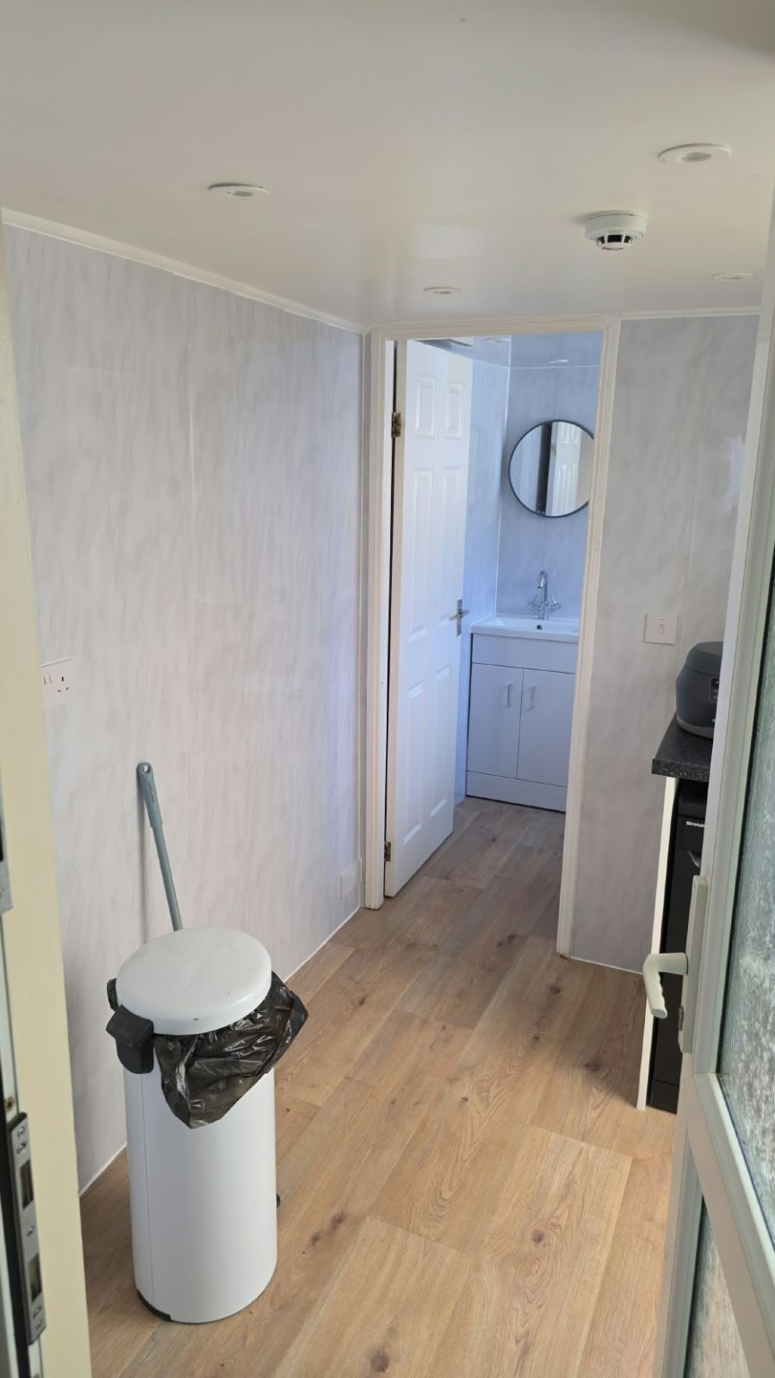 View through the refurbished utility room towards the basin